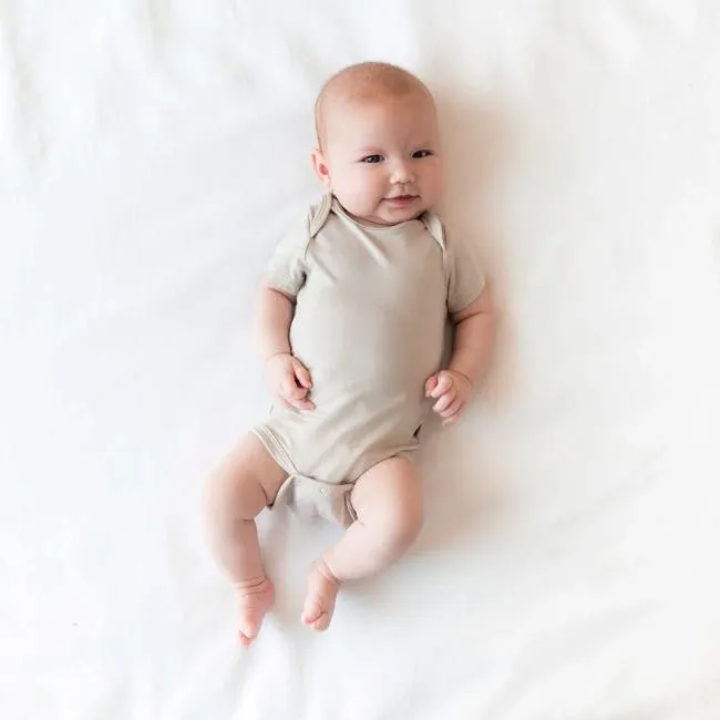 Kyte Baby Short Sleeve Bodysuit  in Oat